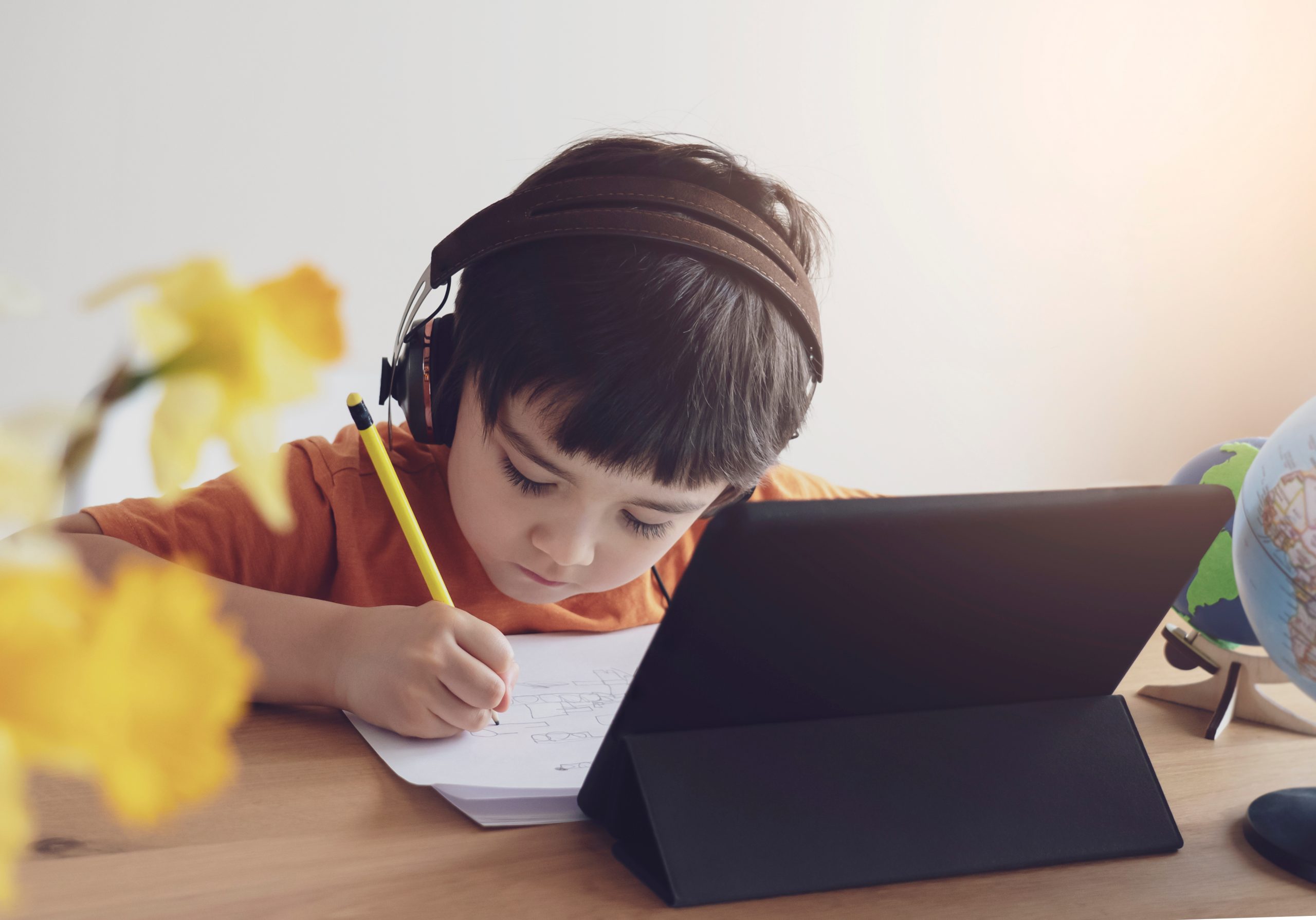young boy engaged in distance learning