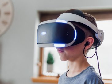 Boy in Vive VR HMD-unsplash