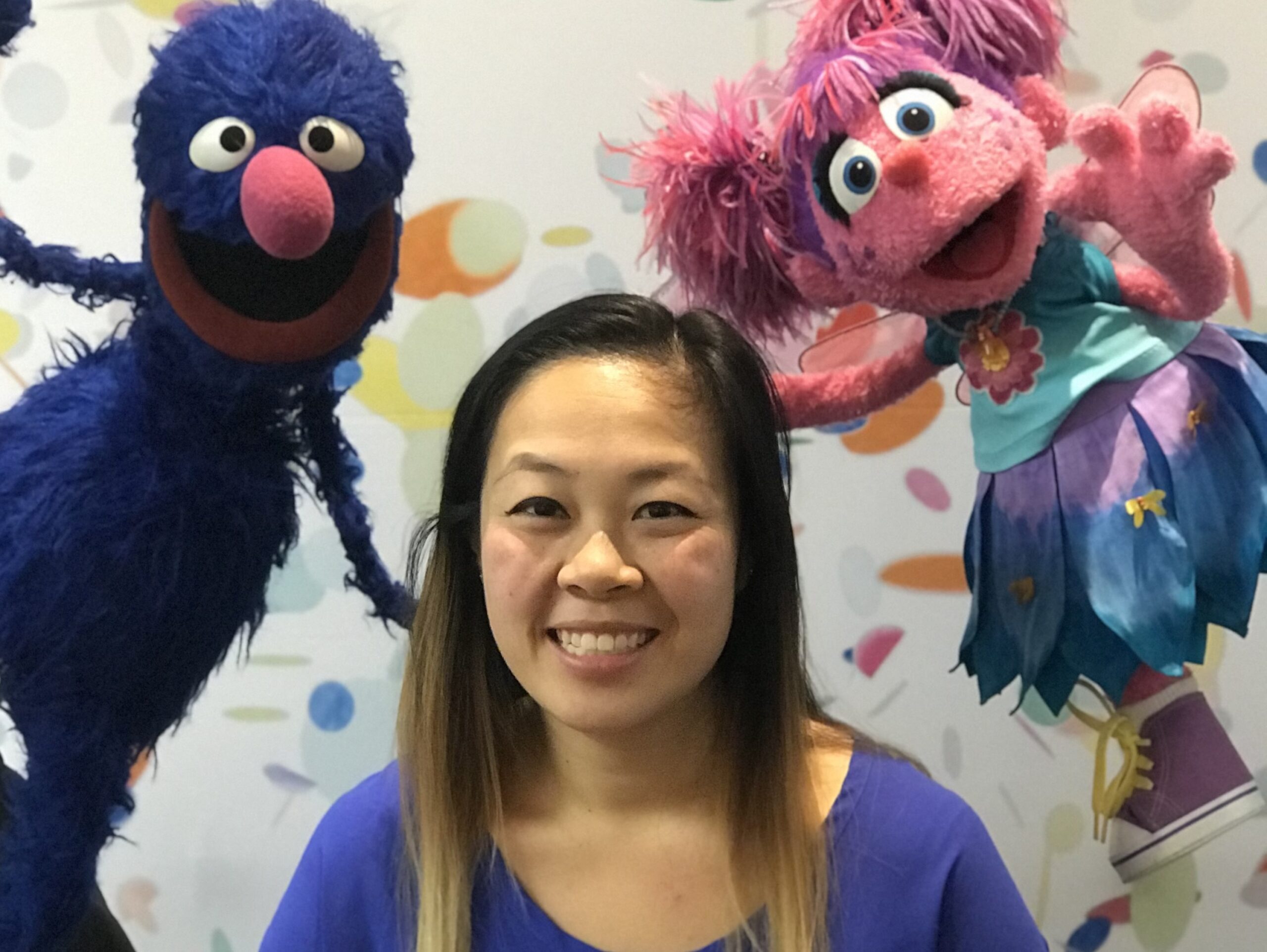 Jenny Ng with Grover and Abby Cadaby