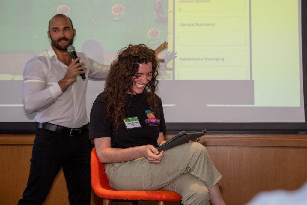 Fabian Froehlich walked the audience through the research methods and fellow researcher Sara Jakubowicz acted out the part of a child participant’s reactions during game play