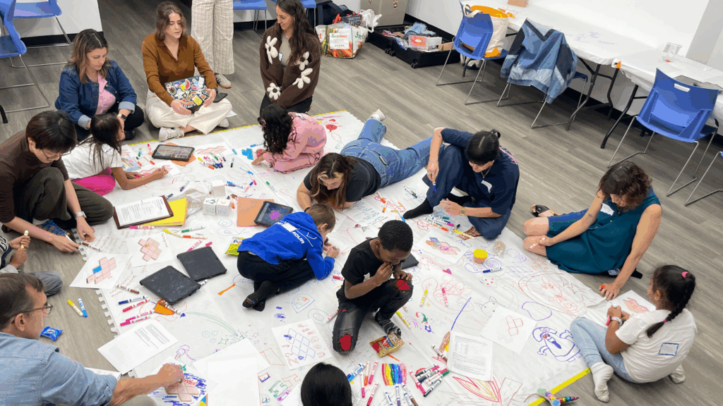 Kids and adults in a co-design session